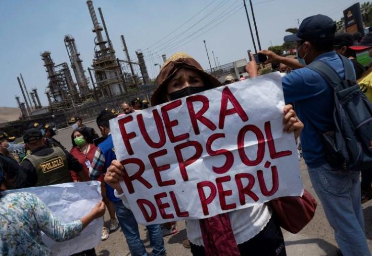 A resident of a community affected by an oil spill at a Repsol refinery in Peru protests against the company on January 20, 2022 in Callao