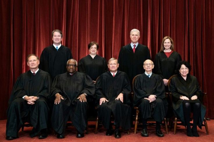 Justice Stephen Breyer (2R, front row) sits with the other eight members of the US Supreme Court