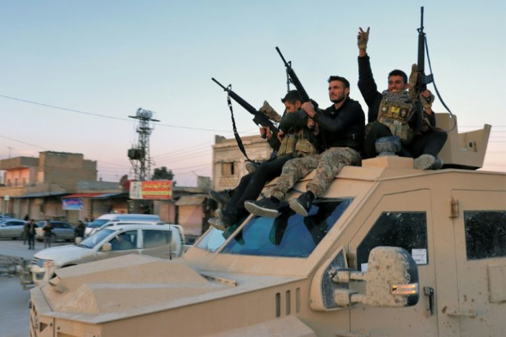 Members of the Syrian Democratic Forces (SDF) deploy outside Ghwayran prison after declaring an end to the Islamic State group takeover