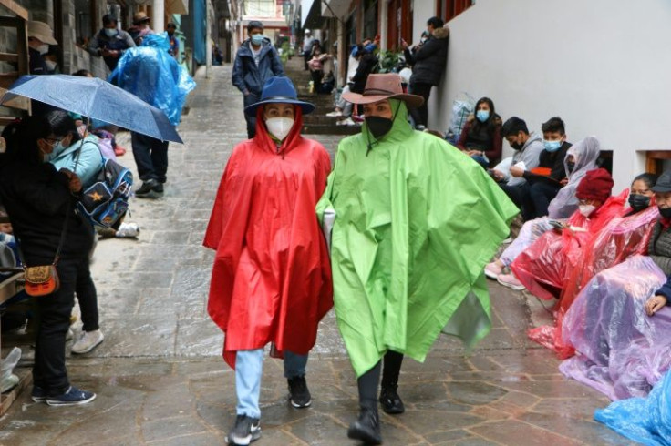 Tourists wait to be evacuated from Machu Picchu Pueblo following heavy rains that cut off the small town