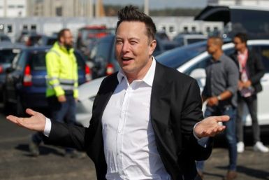 Tesla, Elon Musk's electric auto company, reported record annual profits but warned that supply chain problems would persist into 2022
