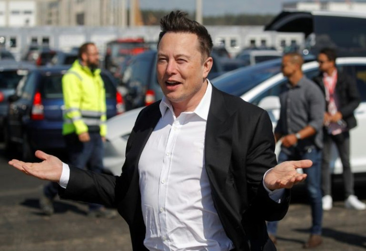 Tesla, Elon Musk's electric auto company, reported record annual profits but warned that supply chain problems would persist into 2022