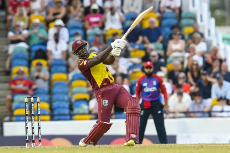 On the attack - Rovman Powell of the West Indies hits a six during his innings of 107 against England in the third T20 at Bridgetown