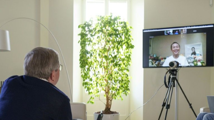 A handout photo posted on the International Olympic Committee website on November 21, 2021 shows IOC president Thomas Bach holding a video call with Chinese tennis star Peng Shuai