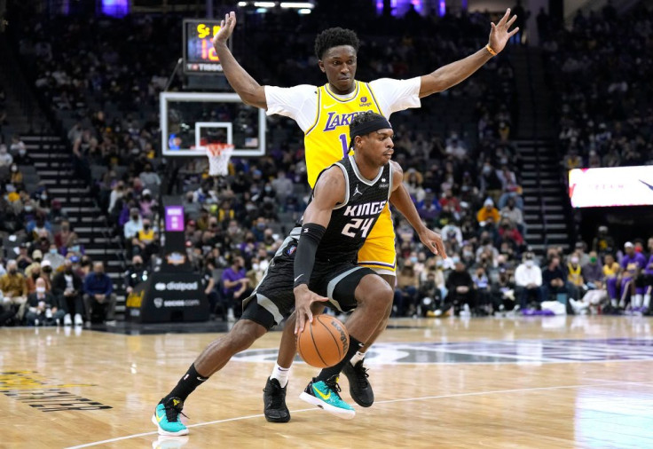 Buddy Hield #24 of the Sacramento Kings dribbles the ball past Stanley Johnson #14 of the Los Angeles Lakers