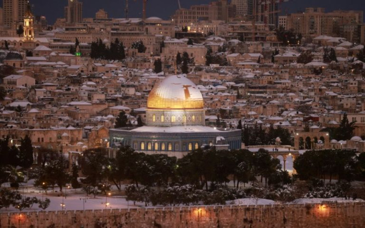 Snow covers Jerusalem's golden-topped Dome of the Rock as rare wintry weather sweeps across the Middle East