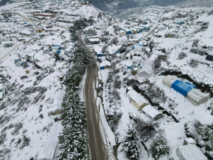 Snow blankets a displaced persons' camp in rebel-held northwestern Syria, making living conditions miserable
