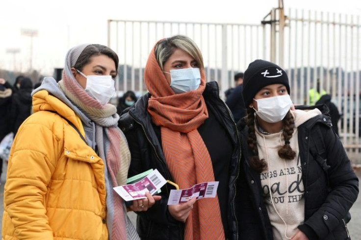 Female Iran supporters show their tickets ahead of the 2022 World Cup qualifier against Iraq -- world football's governing body in 2019 ordered Iran to allow women access without restrictions