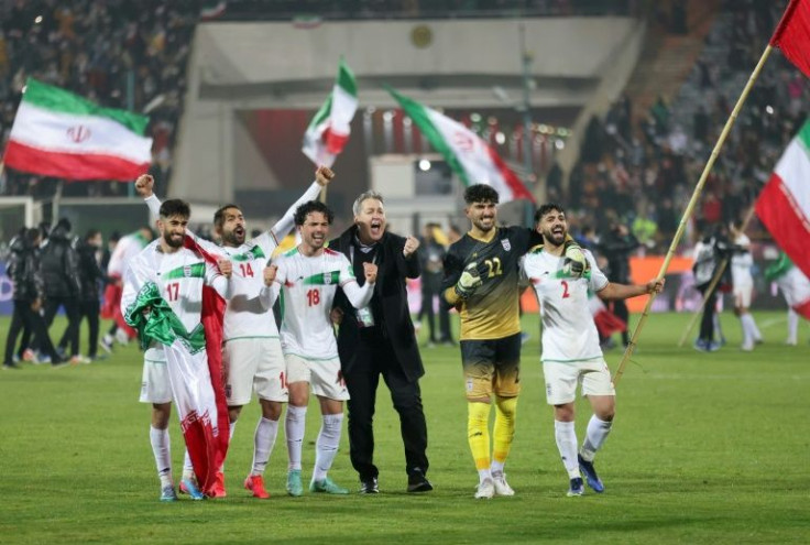 Iran's players celebrate after qualifying for the 2022 World Cup after their 1-0 win over Iraq -- female fans said the presence of women in the stands "definitely had an impact on the result"