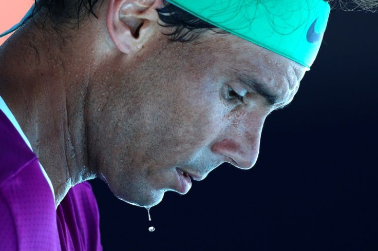 Sweat drips from the face of Spain's Rafael Nadal as he plays against Canada's Denis Shapovalov during their men's singles quarter-final