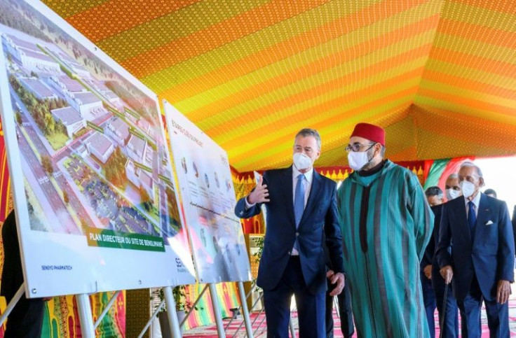Morocco's King Mohammed VI (C) chairs a ceremony to launch the construction of a Covid-19 vaccine manufacturing plant in the region of Benslimane