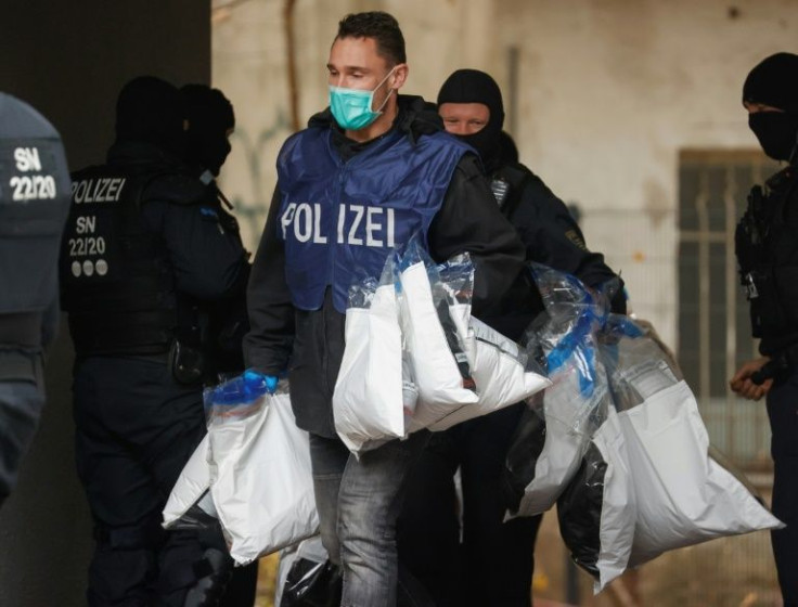 Hundreds of police raided 18 Berlin properties in November 2020, arresting three of the suspects and carrying off bags of evidence