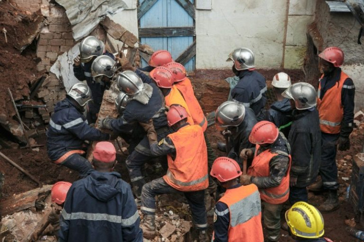 Rescuers searrch through rubble for survivors in Antananarivo after the torrential rains