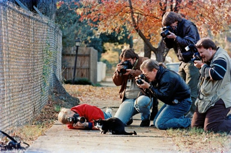 Press photographers surround the Clinton family's pet cat Socks outside the governor's mansion in Little Rock, Arkansas in 1992 -- the year he headed with Bill Clinton to the White House