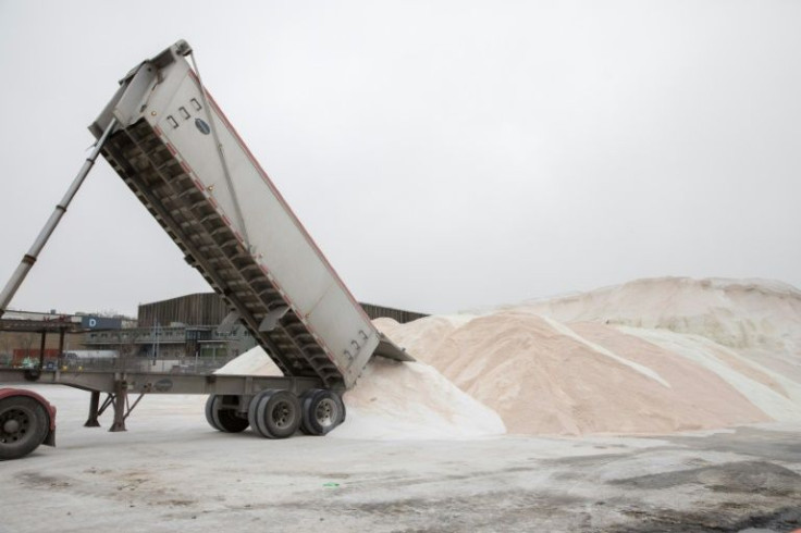 A truck delivers road salt in preparation for a winter storm at the Boston Public Works Department yard on January 28, 2022