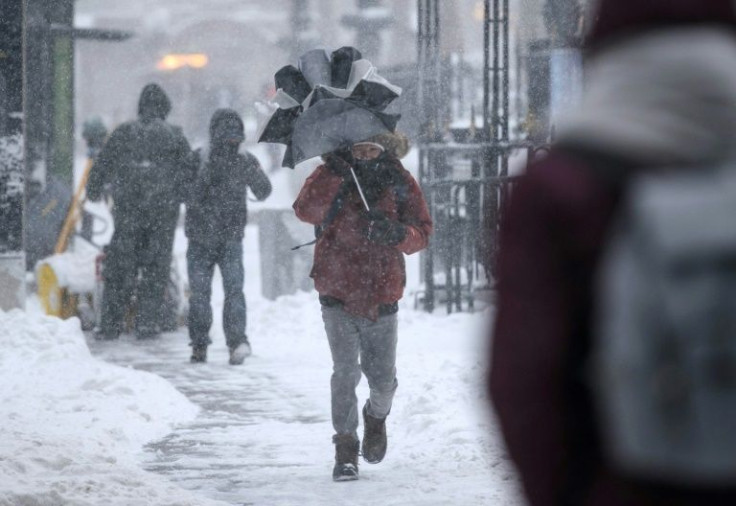 A man walks through the snow in New York City on January 29, 2022