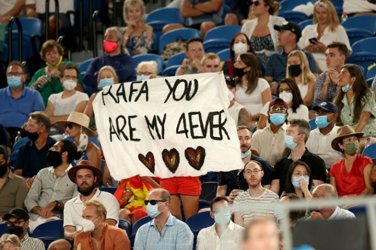 A fan of Spain's Rafael Nadal raises a banner after the men's singles semi-final match against Italy's Matteo Berrettini
