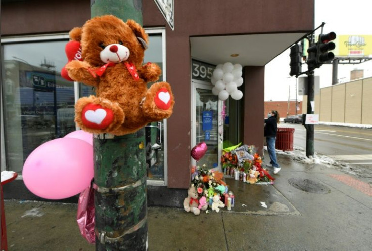 A stuffed teddy bear hangs from a light pole at a memorial for 8-year-old Melissa Ortega, who was struck in Chicago by stray bullets