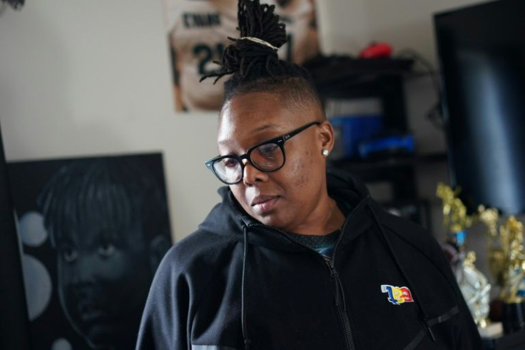 Tiffani Evans, the mother of Peyton "PJ" Evans who was killed after being struck by a stray bullet, is seen in her late son's room