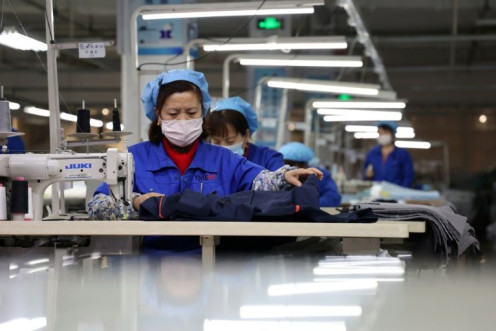 Factory activity in China edged down in January, according to official figures