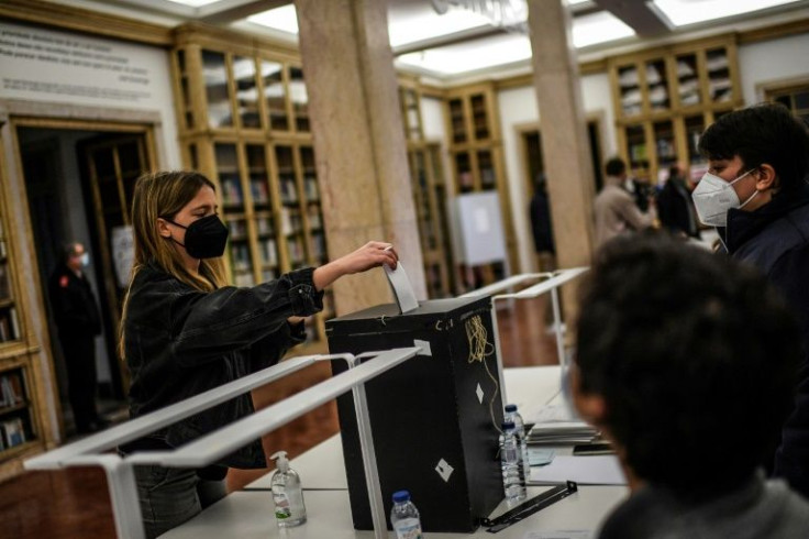 A woman casts her ballot at Galveias Palace polling station in Lisbon