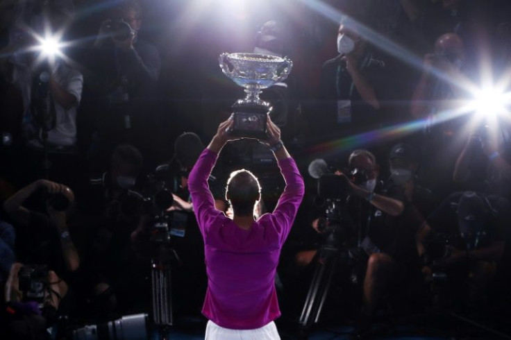 Spain's Rafael Nadal lifts the Norman Brookes Challenge Cup following his victory against Russia's Daniil Medvedev in the Australian Open final