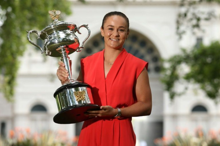 Australia's Ashleigh Barty poses with the 2022 Australian Open winner's trophy