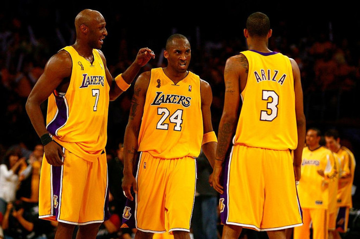 Lamar Odom #7, Kobe Bryant #24 and Trevor Ariza #3 of the Los Angeles Lakers 