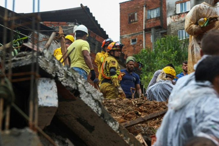 Rescue workers and volunteers search for survivors of a deadly landslide in Franco da Rocha, Brazil