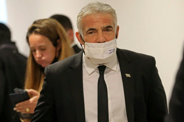 "Israel is not perfect, but it is a democracy committed to international law and open to scrutiny," said Israeli Foreign Minister Yair Lapid