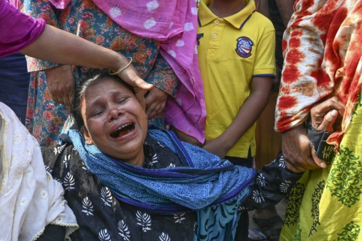 Bangladeshis mourn relatives killed in the collapse of Dhaka's Rana Plaza, home to numerous textile factories
