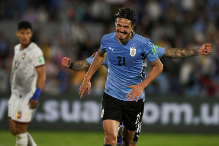 Uruguay's Edinson Cavani celebrates after all but sealing victory over Venezuela in first half stoppage time