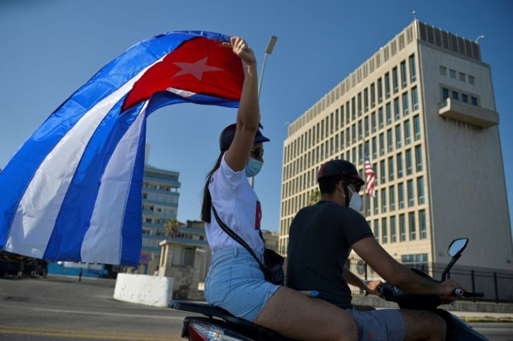 Cuban protesters drive past the US embassy in Havana in March 2021 -- the so-called "Havana syndrome" was first reported by US officials working at the embassy in 2016Â 