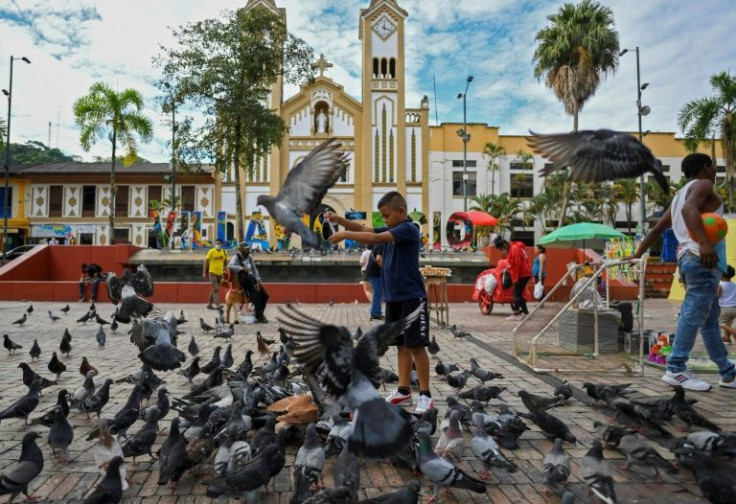 A boy play in the town square of Villavicencio, Colombia, where a clergy sex abuse scandal was uncovered