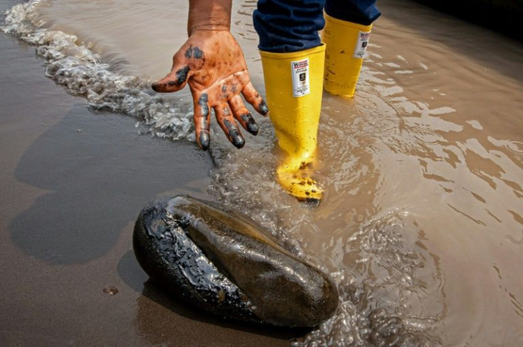 Residents of Puerto Maderos are fed up with repeated oil spills polluting their river