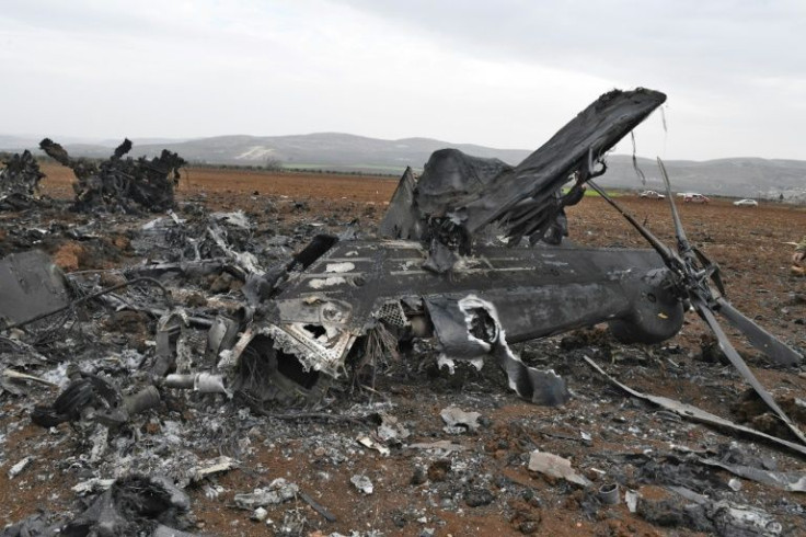US forces who staged an overnight raid in Syria destroyed one of their own helicopters after it developed a mechanical problem -- its remains are pictured in the village of Jinderes northern Aleppo province, on February 3, 2022