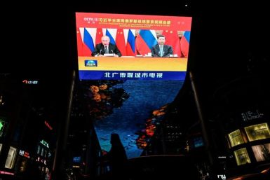 A virtual meeting between Chinese President Xi Jinping and Russian President Vladimir Putin, in shown on a screen in Beijing on December 15, 2021