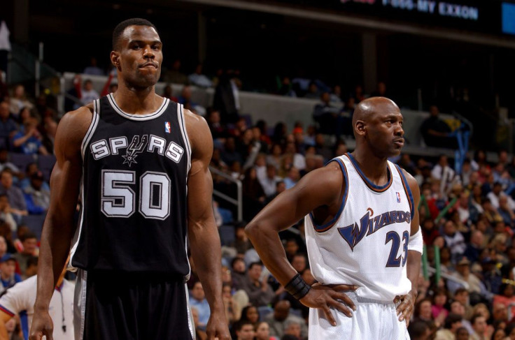 Michael Jordan #23 of the Washington Wizards plays against David Robinson #50 of the San Antonio Spurs