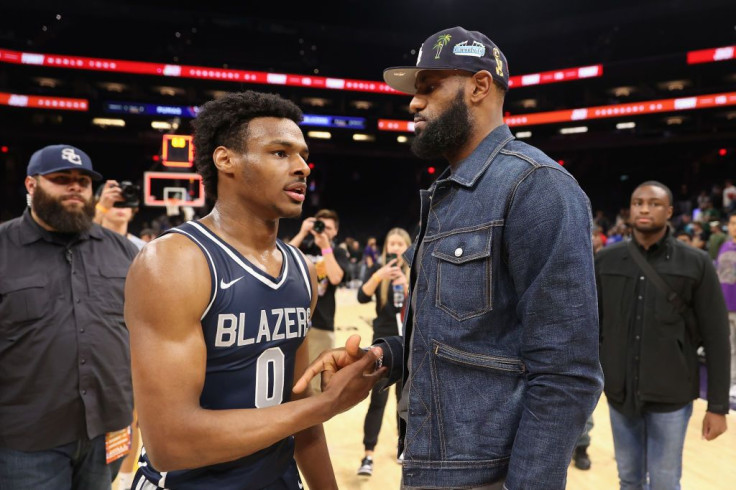 Bronny James #0 of the Sierra Canyon Trailblazers is greeted by his father and NBA player LeBron James 