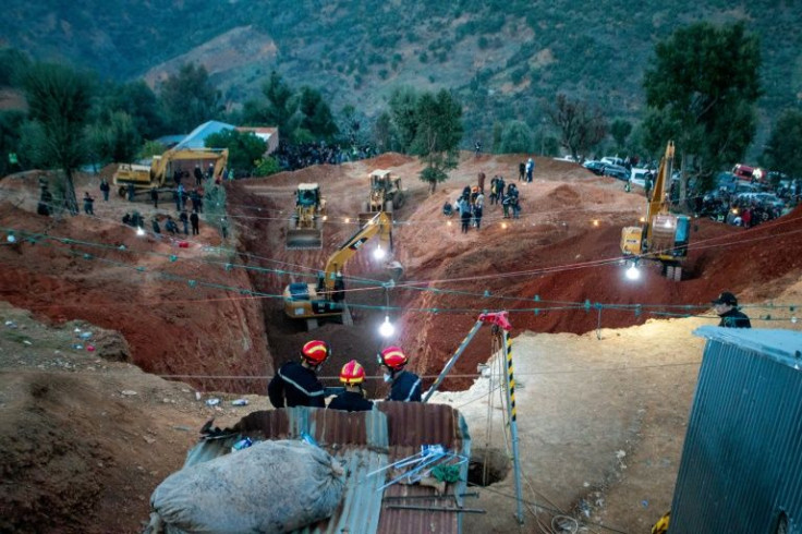 Rescuers have worked under floodlights to clear the area around the 32-metre well where Rayan is trapped