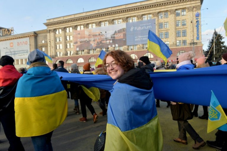 Protesters in Kharkiv wrapped in the Ukrainian flag