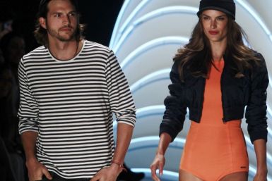 U.S. actor Kutcher and Brazilian model Ambrosio present creations from Colcci&#039;s Summer 2012 collection during Sao Paulo Fashion week