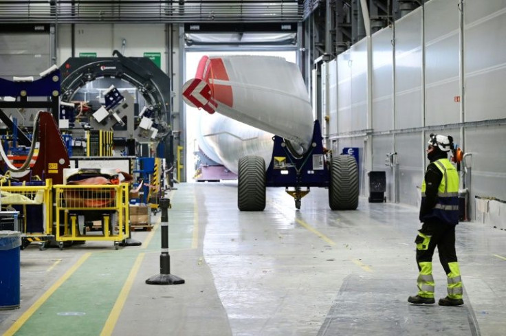 A wind turbine blade is moved outside for shipping at the Siemens Gamesa blade factory in Hull, northeast England.