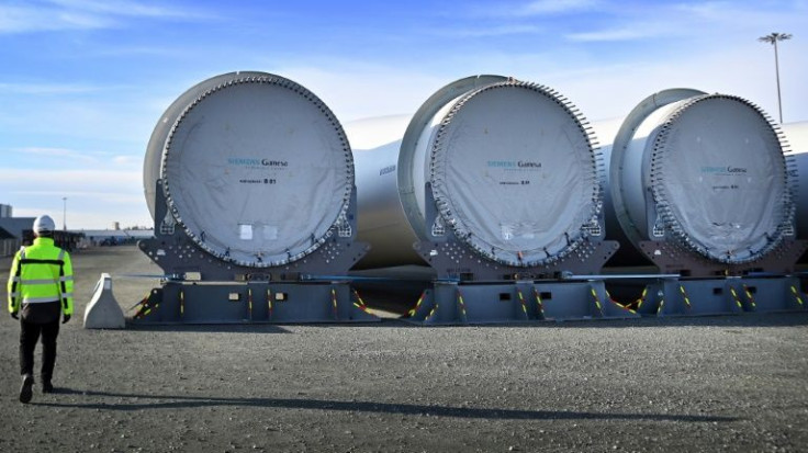 Wind turbine blades are stored on the quayside ready for shipping