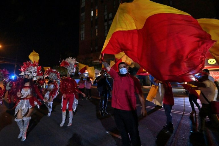 Supporters of Costa Rican presidential candidate Welmer Ramos attend a campaign rally, complete with dancers, in San Jose ahead of February 6, 2022 elections