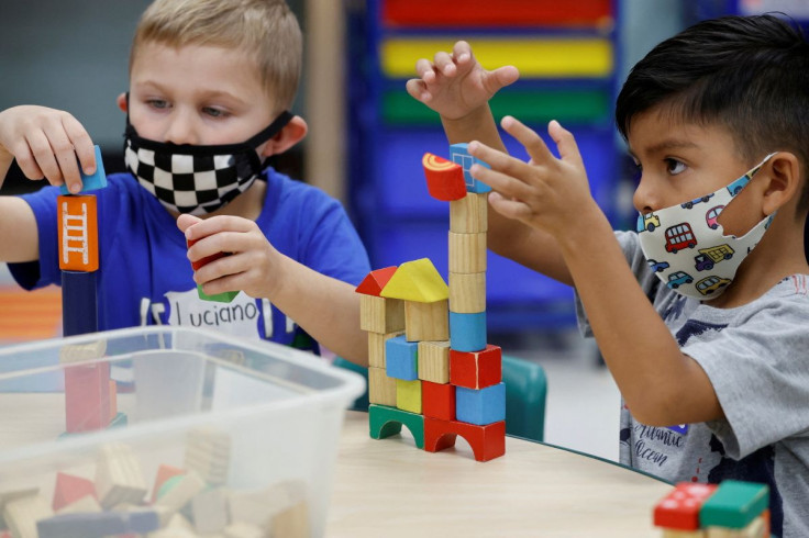 Children wear a masks and wait for U.S. President Joe Biden to visit her pre-Kindergarten class at East End Elementary School to highlight the early childhood education proposal in his Build Back Better infrastructure agenda in North Plainfield, New Jerse