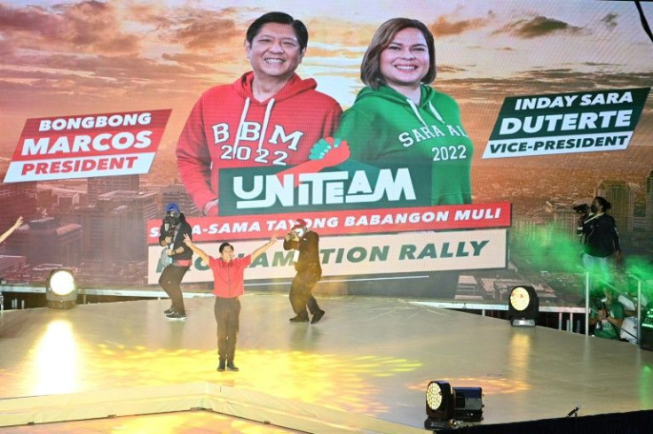 Ferdinand "Bongbong" Marcos Jr (C), gestures onstage to supporters as he kicked off his presidential campaign