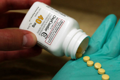 A pharmacist holds prescription painkiller OxyContin, 40mg pills, made by Purdue Pharma L.D. at a local pharmacy, in Provo, Utah, U.S., April 25, 2017.  