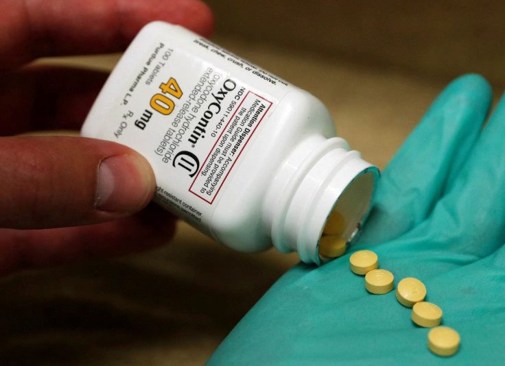 A pharmacist holds prescription painkiller OxyContin, 40mg pills, made by Purdue Pharma L.D. at a local pharmacy, in Provo, Utah, U.S., April 25, 2017.  