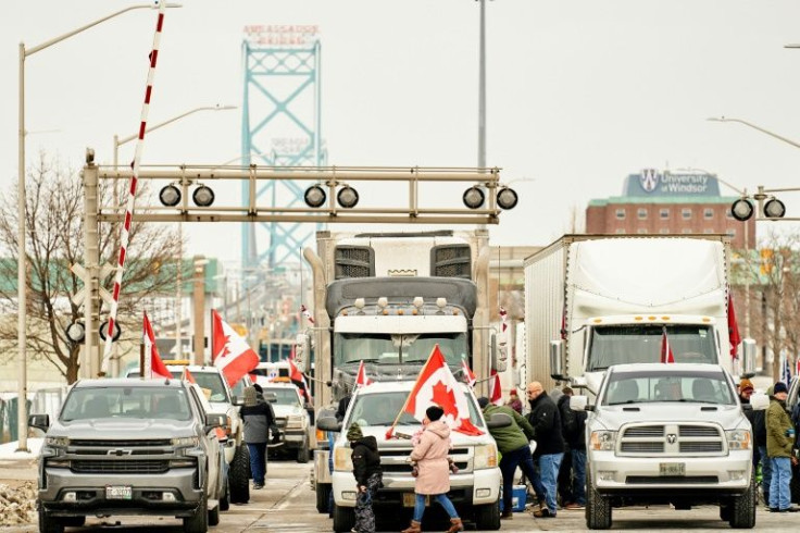 Supporters of a truckers convoy protesting against Covid-19 vaccine mandates blocked traffic in the Canada-bound lanes of the Ambassador Bridge border crossing, in Windsor, Ontario